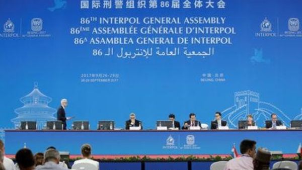 مندوبون يحضرون الجمعية العامة للانتربول في بكين يوم الأربعاء
