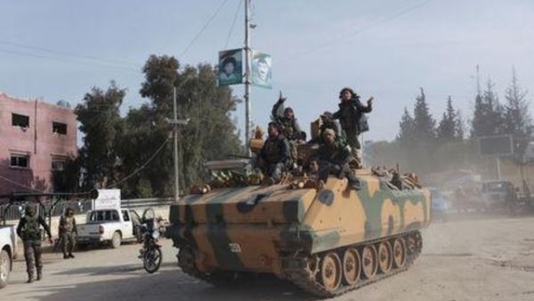 قوات تركية وعناصر من الجيش السوري الحر في عفرين 
