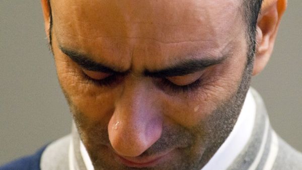 Syrian Ahmed H listens to the verdict at the Szeged town court on November 30, 2016. A Hungarian court jailed a Syrian man for 10 years for allegedly inciting a border riot by migrants last year, ruling it an "act of terror" and sparking outrage from rights groups. (AFP/Csaba Segesvari)