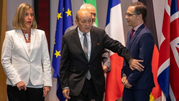 Iran's FM Mohammad Javad Zarif (2nd R), France's FM Jean-Yves Le Drian (2nd L), Germany FM Heiko Maas (R), EU High Representative for Foreign Affairs Federica Mogherini and Britain's Foreign Secretary arrive for a meeting of EU/E3 with Iran in Brussels on May 15, 2018. (Olivier Matthys/ AFP)
