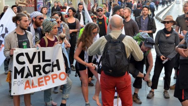 Activists from the "Civil March for Aleppo" group gather on March 22, 2017 in Sarajevo, after walking 1000 kilometers through Europe, commemorating 25 years since the beginning of the siege of Sarajevo, while also protesting against the siege of Aleppo and other cities in Syria. (AFP/Elvis Barukcic)