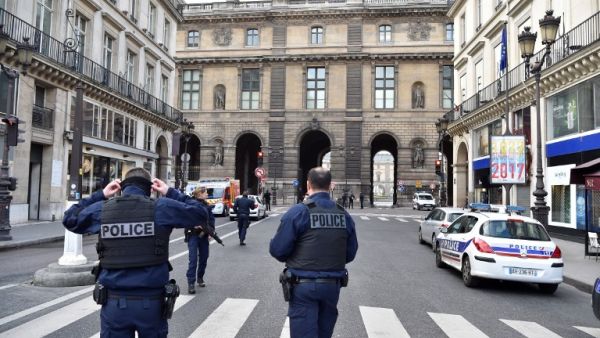 French police officers patrol near the Louvre museum on February 3, 2017 in Paris after a soldier has shot and gravely injured a man who tried to attack him. (AFP/Alain Jocard)
