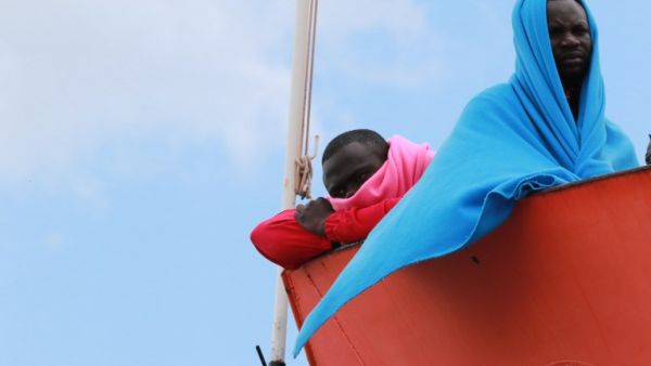 Migrants wait to disembark from the Aquarius rescue Ship run by NGO S.O.S. Mediterranee and Medecins Sans Frontieres in the port of Salerno after a rescue operation in the Mediterranean sea, on May 26 2017. (Carlo Hermann/AFP)