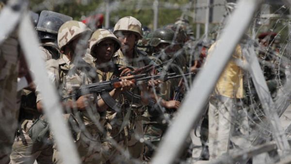 Soldiers of the Egyptian Army stand guard in front of the headquarters of the Egyptian Republican Guard in Nasr City on July 5, 2013 in Cairo, Egypt.  (Photo by Ed Giles/Getty Images).
  Soldiers of the Egyptian Army stand guard in front of the headquarters of the Egyptian Republican Guard in Nasr City on July 5, 2013 in Cairo, Egypt.  (Photo by Ed Giles/Getty Images).