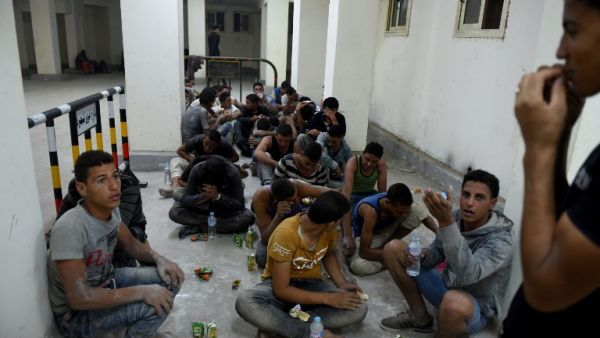Survivors from a boat that capsized, off Egypt's north coast, sit in a police station in Rashid in northern Egypt, on September 21, 2016. (AFP/Mohammed El-Shahed) Survivors from a boat that capsized, off Egypt's north coast, sit in a police station in Rashid in northern Egypt, on September 21, 2016. (AFP/Mohammed El-Shahed)