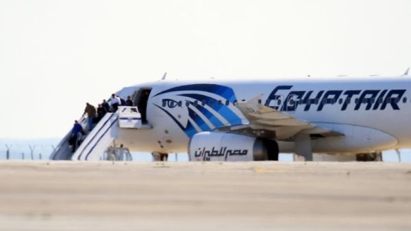 Passengers disembark from the hijacked plane in Cyprus. (AFP / George Michael)