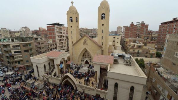People gather outside the Mar Girgis Coptic Church in Tanta after a bomb blast. (AFP/ File Photo)