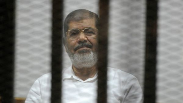 Former Egyptian president Mohamed Morsi faces charges of helping up to 20,000 people escape prison in 2011, including members of the Muslim Brotherhood, Hamas, and Hezbollah. (AFP/File)