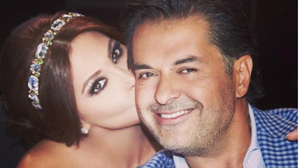 Elissa plants a birthday kiss on Ragheb's cheek. (Facebook)