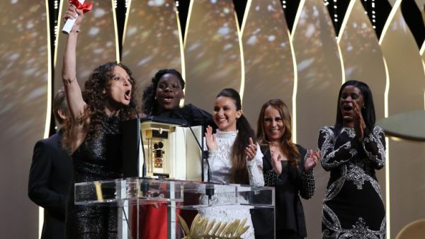 French-Moroccan director Houda Benyamina accepts the Camera d'Or for the film "Divine" during the closing ceremony of the 69th Cannes Film Festival on May 22, 2016. (AFP/Valery Hache)