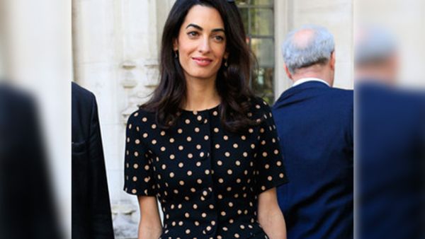 Amal's business unusual as she stands out in a sea of suits. (AFP/File)
