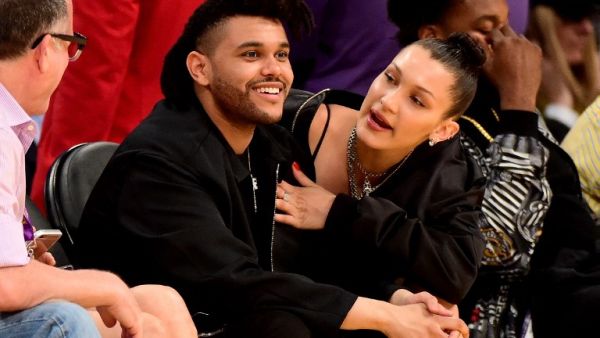Bella and The Weeknd were in matching black, with Bella sporting some trainers instead of her usual stilettos. (AFP/Harry How)
