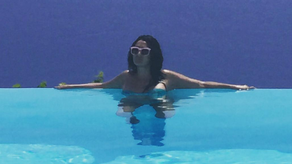 Ghada Abdel Razek maxin' and relaxin' in the sun. Um, what is she wearing?! (Instagram)