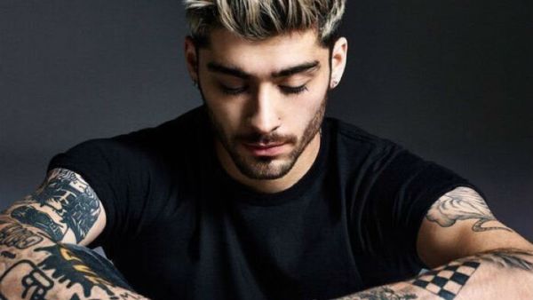 Malik's tattoos distinguished him from the man in the video. (AFP/File)