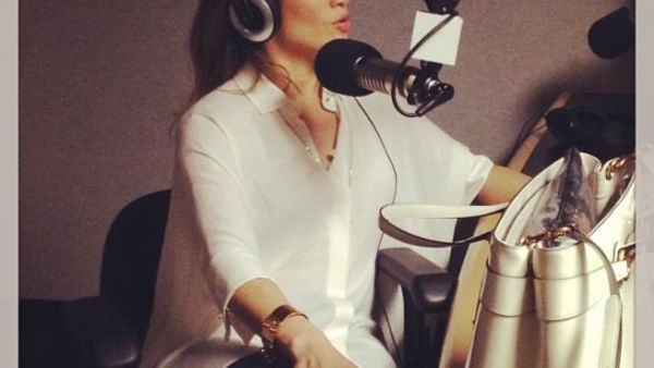 Jennifer Lopez talking on the mic (Photo courtesy of Facebook)