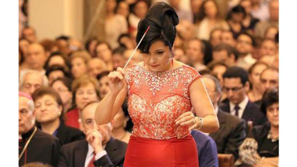 Joana Nachef conducts and looks good doing it. Why not? (Image courtesy of now.mmedia.me)