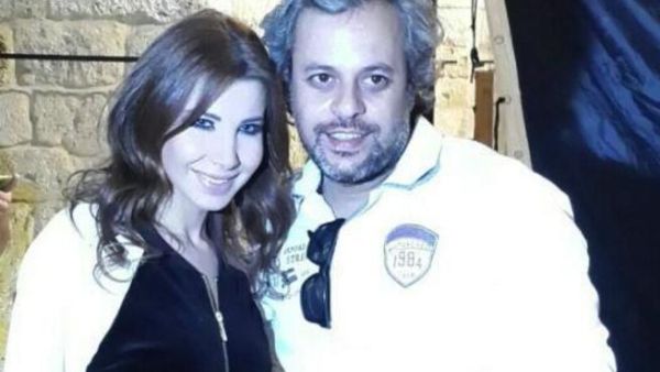 Behind the scenes of Nancy's new music video with her director. (Image: Twitter)