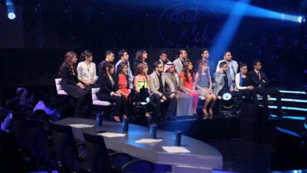 The remaining 19 Arab Idol contestants sit on pins and needles