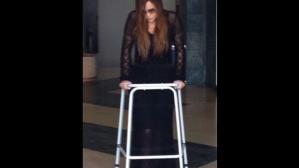 Carole Samaha is up and at 'em again with the support of a walker (Image: Twitter)