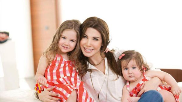 Nancy Ajram takes time out for hugs and kisses with her sweet daughters Milla and Ella