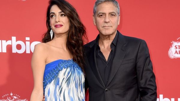 Amal and George Clooney. (KEVIN WINTER / GETTY IMAGES NORTH AMERICA / AFP) Amal and George Clooney. (KEVIN WINTER / GETTY IMAGES NORTH AMERICA / AFP)