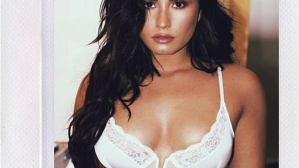 'The deliciously, devious trap was set': Demi Lovato's fans have gone wild over her 'strategic' and VERY public flirting with Superman star Henry Cavill (Source: Demi Lovato - Instagram)