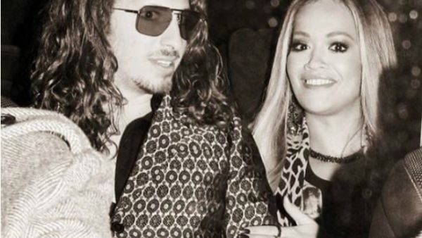 Earlier this week, Rita uploaded a black-and-white snapshot of herself posing with a hand affectionate on the rocker's arm at Monday night's glitzy event London. (Source: Instagram - @ritaora)