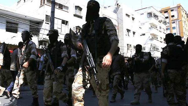 Palestinian Islamic Jihad militants parade down a street in downtown Gaza City on August 29, 2014. (AFP/File)