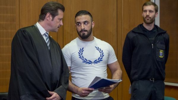 Defendant Aria L (C) talks with his lawyer Andreas Bensch as he waits for the opening of his trial at court in Frankfurt am Main, western Germany, on May 3, 2016.(AFP/Torsten Silz) Defendant Aria L (C) talks with his lawyer Andreas Bensch as he waits for the opening of his trial at court in Frankfurt am Main, western Germany, on May 3, 2016.(AFP/Torsten Silz)