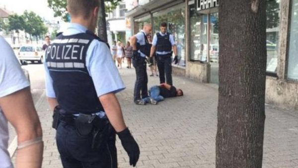 Police are seen arresting the man who began attacking people with a machete in the small town of Reutlingen in southwest Germany. (Twitter)