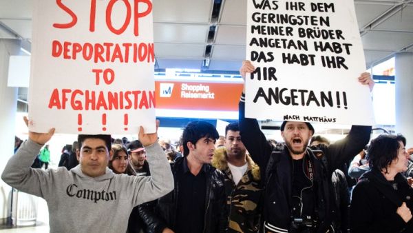 People take part in a demonstration against the deportation of some 50 Afghan refugees from Munich airport, southern Germany, on February 22, 2017. (AFP/Matthias Balk)