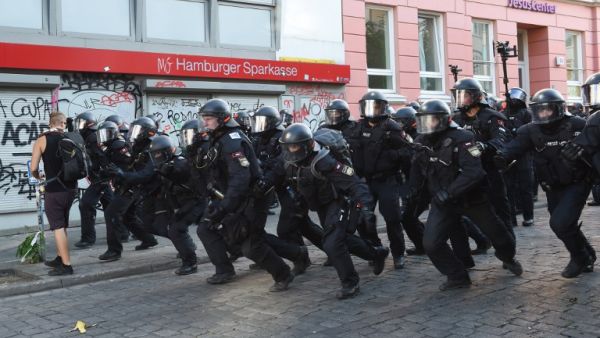 Riot police charge forward towards protesters on July 8, 2017 in Hamburg, northern Germany as world leaders meet during the G20 summit (Christof Stache/AFP)