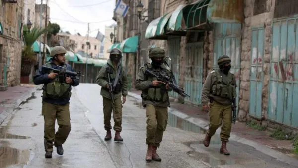 Israeli forces are seen on patrol in Hebron. (AFP/File)