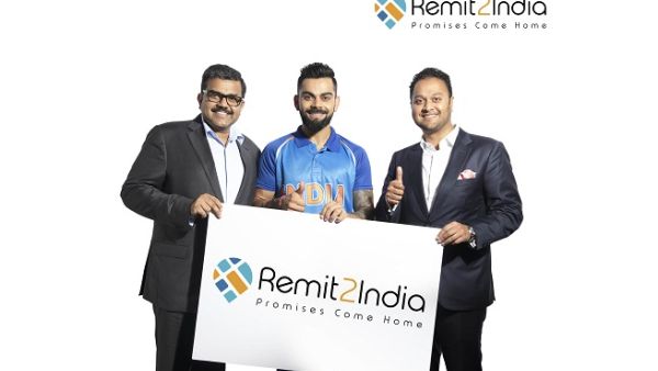 Indian Cricket Captain Virat Kohli with Finablr Executive Director Binay Shetty (right), and Finablr Executive Director Promoth Manghat (left).