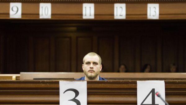 Henri van Breda sits in the dock at the Western Cape High Court to hear the verdict in his trial for allegedly killing his two parents, brother and maiming his sister with an axe in their luxury home, in Cape Town on May 21, 2018/AFP