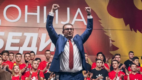 Leader of the opposition party, conservative VMRO-DPMNE, Hristijan Mickoski greets his supporters during a protest in front of the Government building in Skopje on June 2, 2018/AFP Leader of the opposition party, conservative VMRO-DPMNE, Hristijan Mickoski greets his supporters during a protest in front of the Government building in Skopje on June 2, 2018/AFP