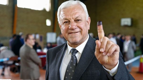 Iraqi ambassador in Iran Rajih al-Moussawi goes to a polling station. (Twitter)