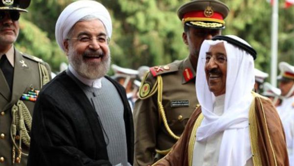 Iranian President Hassan Rouhani, left, greets the Emir of Kuwait, Sheikh Sabah Al-Ahmad Al Sabah in Tehran on June 1, 2014 (AFP/Atta Kenare)