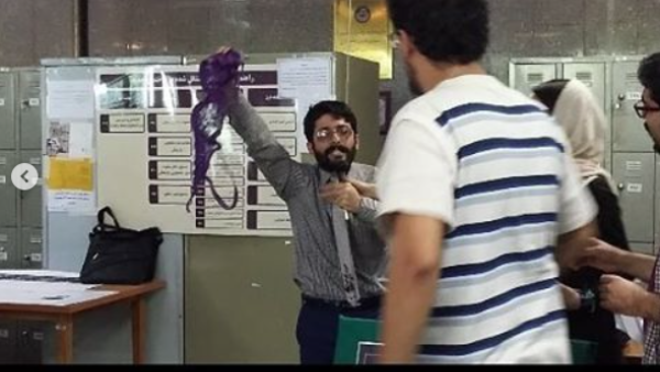 Conservative student in Iran university waves purple bra around in class in opposition of president Rouhani. 