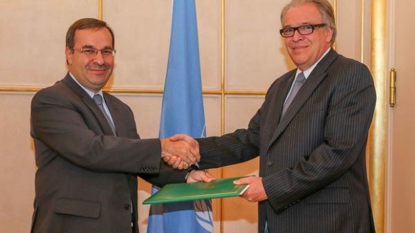 Syrian ambassador Hussam Edin Aala, left, with Vladimir Gratchev, representative of Secretary-General of the UN Conference (AFP/File Photo)