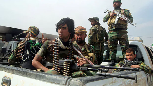 Members of Iraq's Popular Mobilization Units drive into Tikrit, Iraq in 2015. (AFP/File)