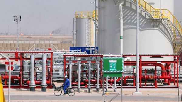 An Iraqi labourer rides a bike in the newly opened section at the oil refinery of Zubair, southwest of Basra in southern Iraq. (AFP/File)