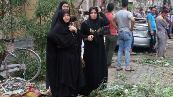 Iraqis react on May 10, 2016 the site of a car bomb explosion which hit the Shifta area in the city of Baquba the previous day, killing at least 10 people. (AFP/Younis al-Bayati)
