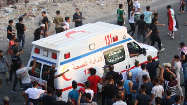 An Iraqi ambulance leaves during a protest against the government and the lack of basic services outside the regional government headquarters in the southern city of Basra on September 5, 2018. (Haidar MOHAMMED ALI / AFP)