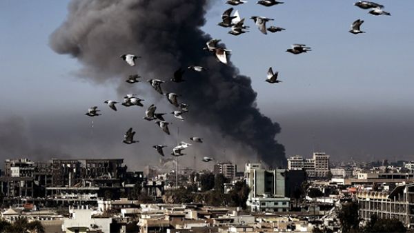 Smoke rises following an airstrike in western Mosul on March 6, 2017, during an offensive by Iraqi forces to retake the western parts of the city from Islamic State (IS) group.(AFP/Aris Messinis)
