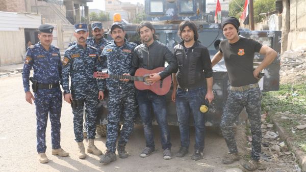 Recognizable for their mops of hair, the pair accompanied Iraqi security forces throughout much of the campaign for Mosul (Facebook)