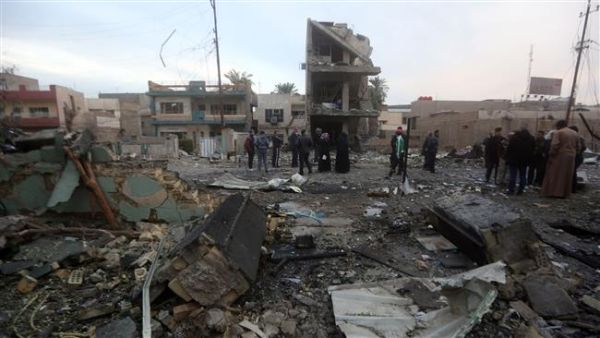 People gather at the site of a bomb attack in eastern Baghdad, Iraq. (AFP/ File Photo)