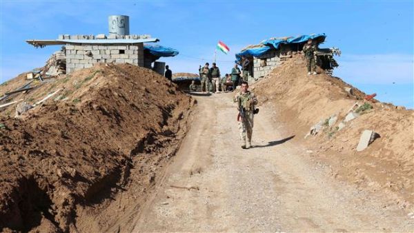 A picture taken on Jan. 11, 2016 shows Kurdish Peshmerga forces monitoring trenches in Daquq in Kirkuk. (AFP)
