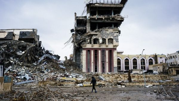 An Iraqi man walks outside Mosul's University on January 22, 2017, a week after Iraqi counter-terrorism service (CTS) retook it from Daesh. (AFP/Dimitar Dilkoff)