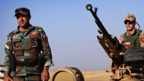 Kurdish peshmerga fighters scan the horizon at a checkpoint in northern Iraq, the group took back the north-east city of Jaloula from ISIL militants last month. (AFP/File)